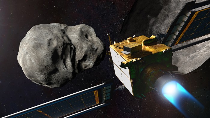 Illustration of cubical space probe approaching an asteroid.