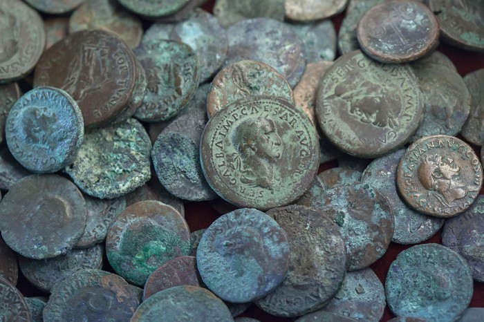 Roman bronze coins found in the Thermopolium of Vetutius Placidus in Pompeii, Italy in May 1939.