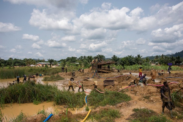 A group of illegal gold panners work in Kibi area, Ghana, where most of the work is done by hand or simple machinery.