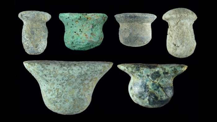 An array of small plug-shaped Neolithic ornaments used in ear and lip piercings