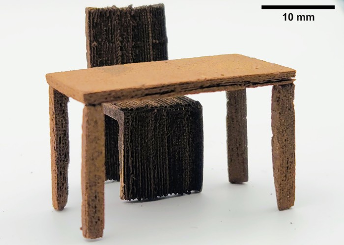 A 3D-printed table and chair made out of wood which are only a few centimetres high