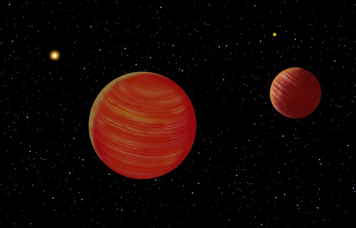 An artist's conception of the Epsilon Indi system showing Epsilon Indi and the brown-dwarf binary companions. Due to the perspective of the brown dwarf companions, the relative sizes are not represented in this illustration.