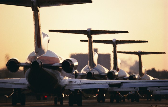 Airline Jets Lined up on Runway.