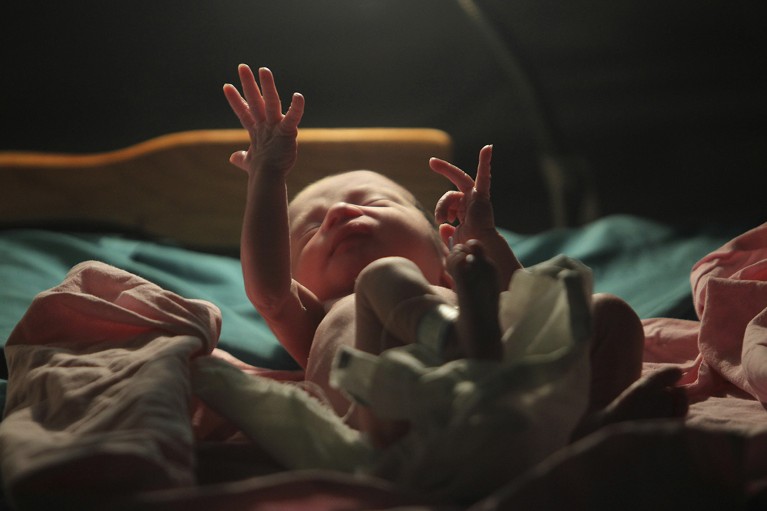 A baby gestures minutes after he was born