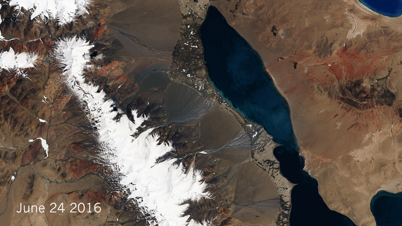 The same mountain valley in Tibet is shown before and after part of a glacier sheared off on 17 July 2016.