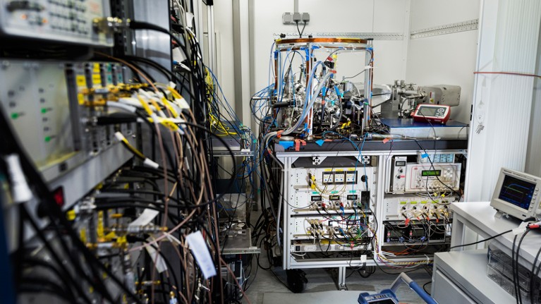 A vacuum system and electronics for a laser are among the components required for a portable atomic clock housed in a trailer.