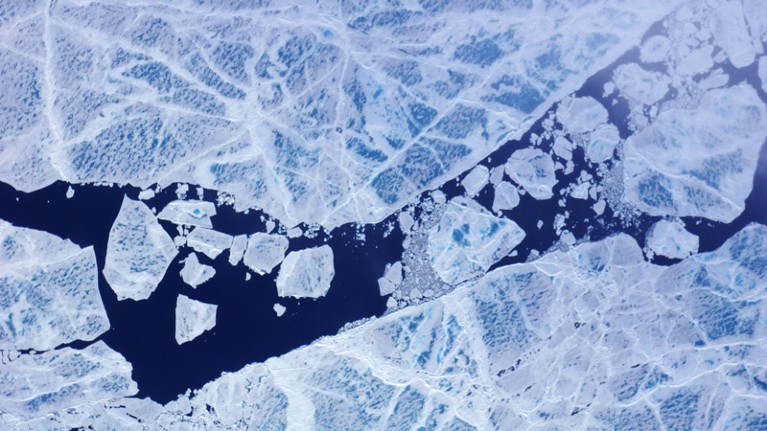 Fractured sea ice, dotted with melt ponds