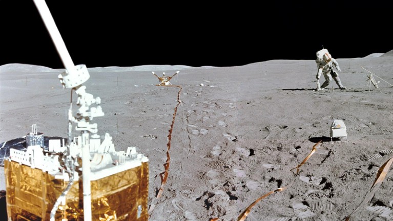 Apollo 15 astronaut carries out experiments on the surface of the Moon