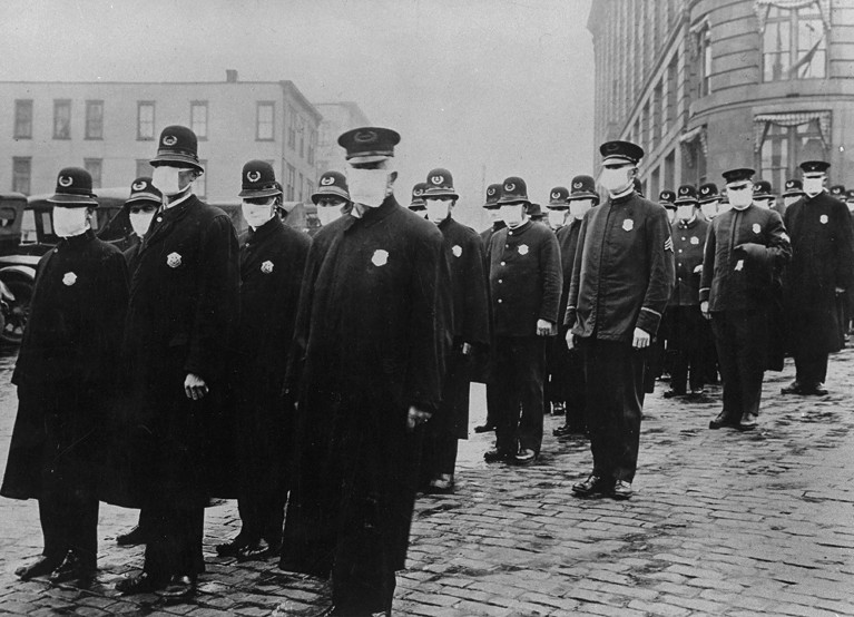 Seattle policemen wearing protective gauze face masks during influenza epidemic of 1918