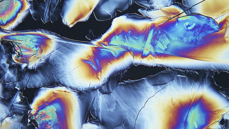 Colourful polarised light micrograph of aspirin (acetylsalicylic acid) crystals