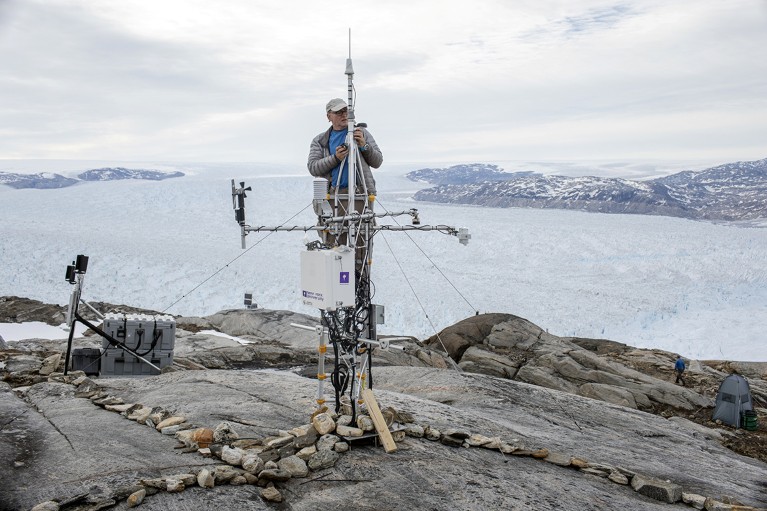 Researcher repairs GPS module near glacier