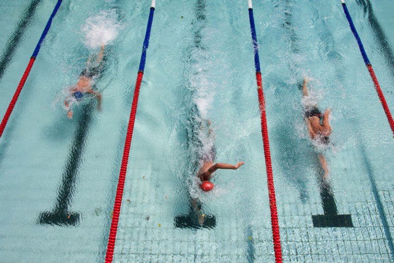 Three swimmers in a race