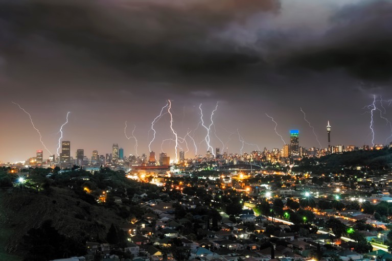 A thunderstorm rolls across the city of Johannesburg sending a multitude of forked lightning strikes into the city centre.