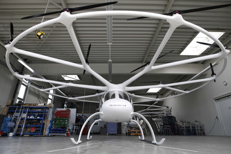 A Volocopter 2X multirotor electric helicopter stands in a hangar at the Volocopter GmbH headquarters in Bruchsal, Germany