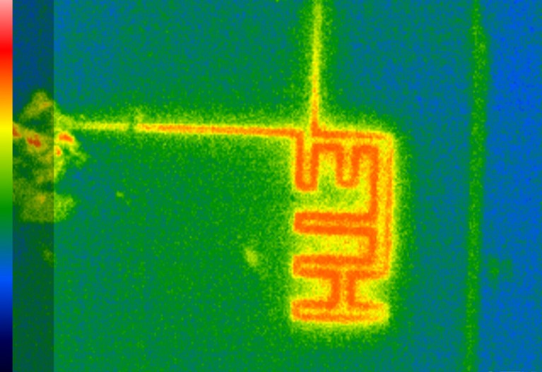 A thermographic image of a patterned ITO glass slide with a bolometric camera