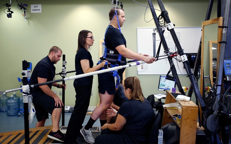 Rob Summers practices treadmill locomotive training at Frazier Rehab Institute in Louisville, Kentucky