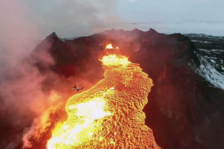 A drone flying over the huge lava lake in Iceland