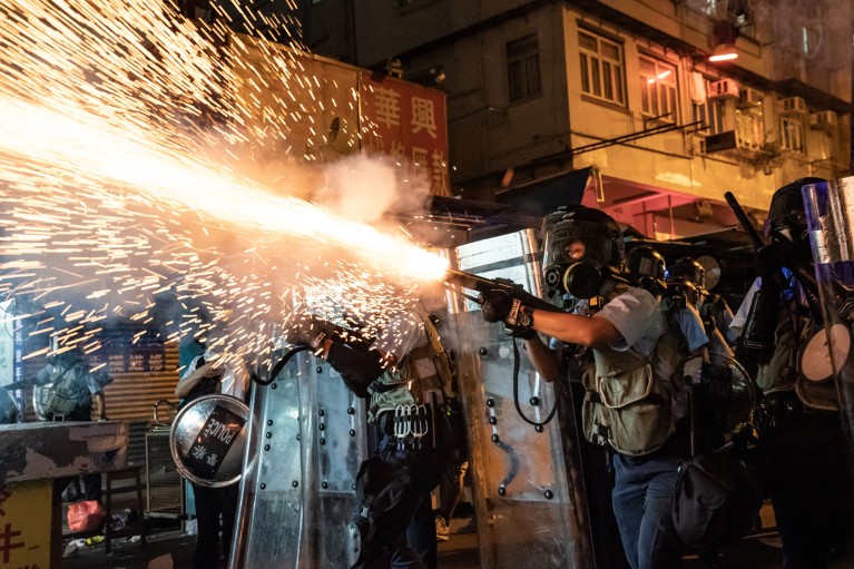 Police fire tear gas to clear pro-Democracy protesters in Hong Kong