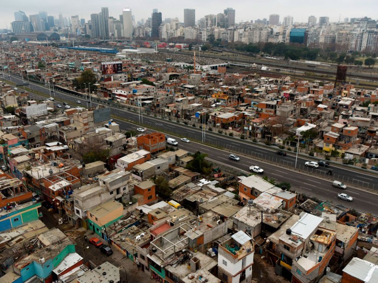 View of the Villa 31 shantytown with the upscale Recoleta neighborhood in the background in Buenos Aires, Argentina.