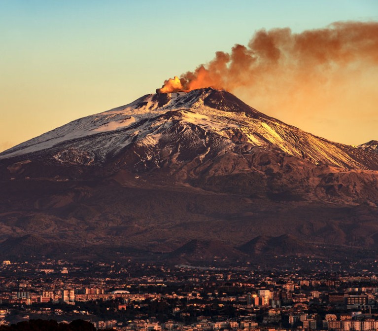 Catania and Mount Etna Volcano in Sicily, Italy.