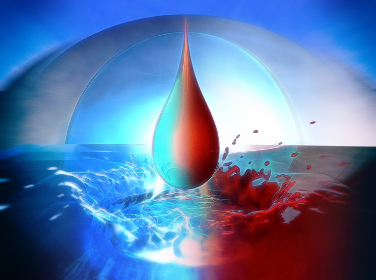 Artistic image of a falling drop of liquid - half coloured blue, half red