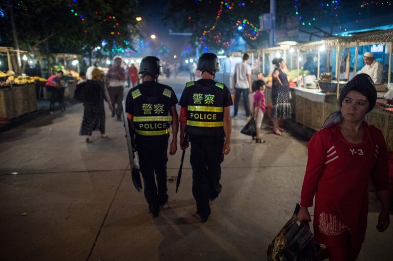 Police patrolling in a night food market near the Id Kah Mosque in Kashgar in China's Xinjiang Uighur Autonomous Region