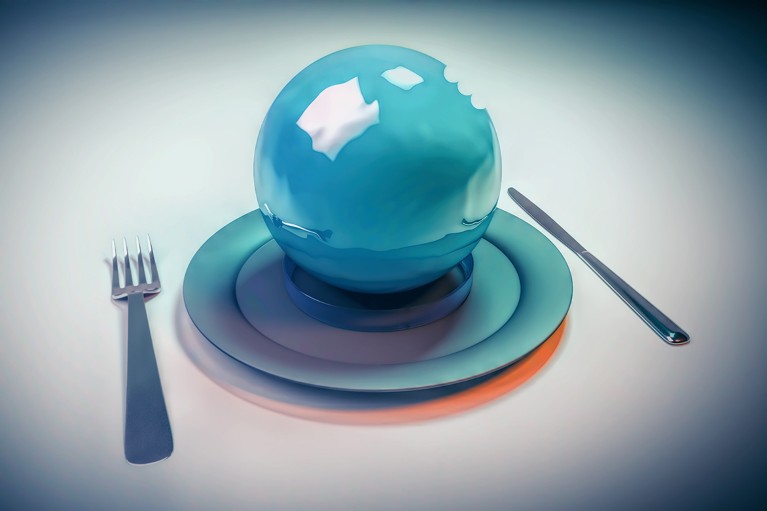 Artistic image of a blue sphere on a plate with a knife and fork