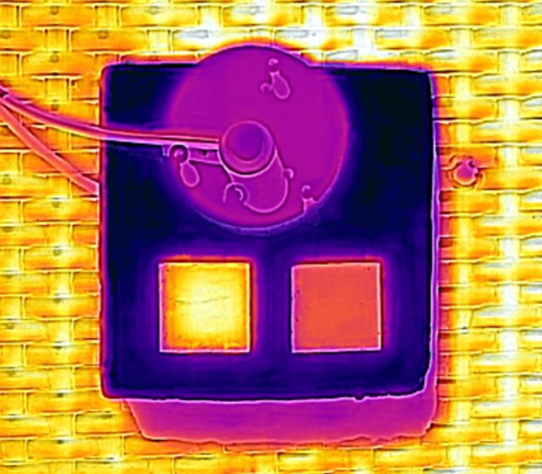 Thermal camera picture of the monolayer and the bilayer. Bilayer (RIGHT) stays cooler under sun exposure.