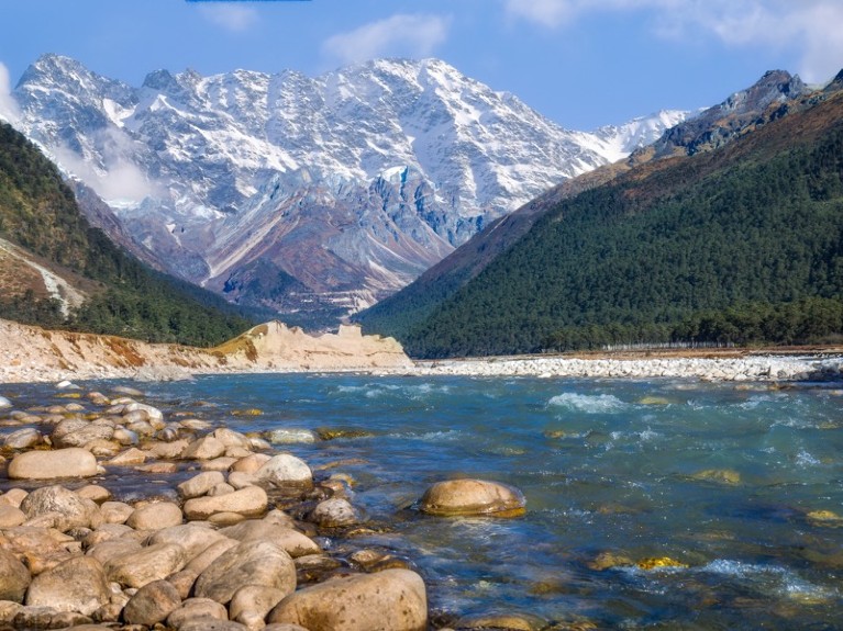 Scenic Yumthang valley with view of river Teesta and majestic Himalayan range.
