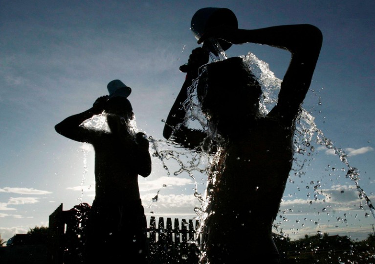Silhouette of boys bathing