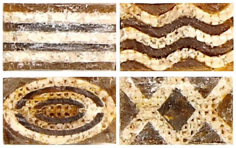 Four pieces of a material made of brown polymer and white calcium carbonate, in various patterns.