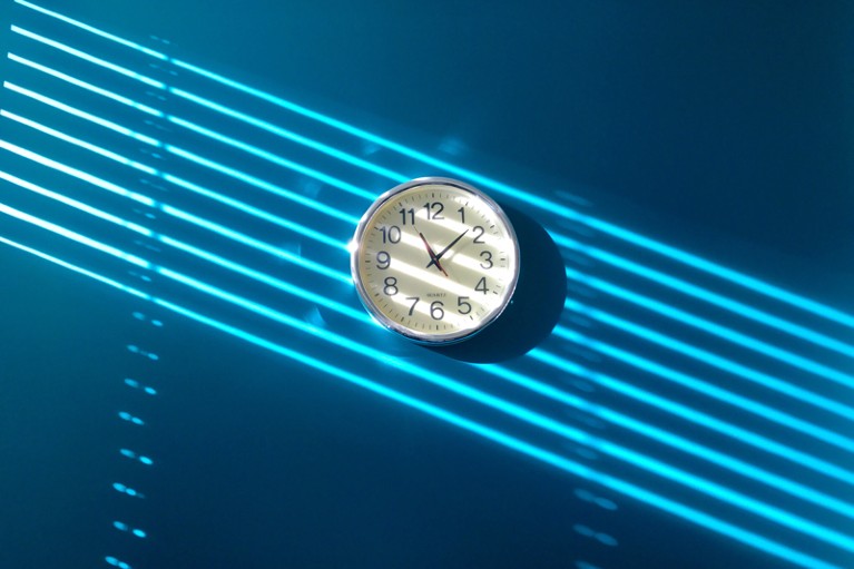 Clock hanging on a blue wall