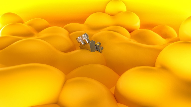 The eyepiece of a microscope pokes out from amid a sea of yellow cells that threatens to engulf it
