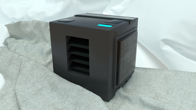 A black cuboid machine with a glowing blue light on its top sits on a crumpled bed sheet