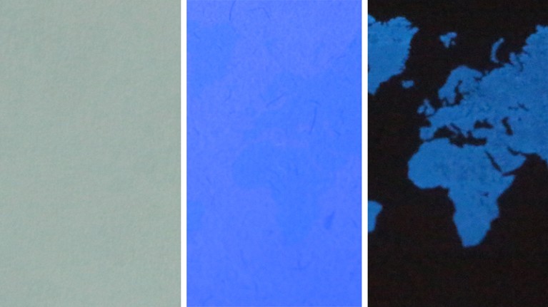 Three images of a world map inkjet printed with the TSP ink under daylight, UV on and UV off conditions