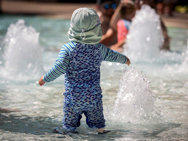 A young boy plays in a public pool during an unprecedented heat wave in Portland, Oregon, U.S. June 27, 2021.