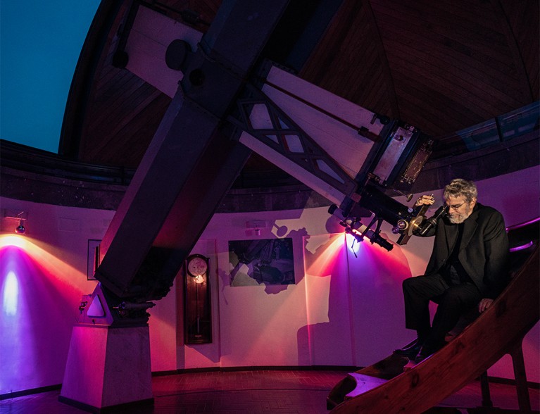 Brother Guy Consolmagno, astronomer and director of the Specola Vaticana, looking through the Vatican’s historic telescope.