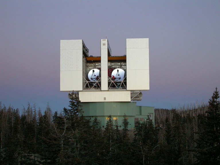 The Large Binocular Telescope Interferometer surrounded by trees.