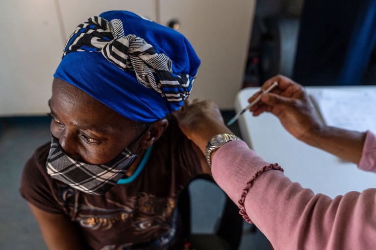 A woman is vaccinated against COVID-19 in Johannesburg, South Africa