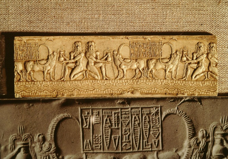 Relief created from a cylinder seal from the Akkad dynasty showing water gods and baffalo