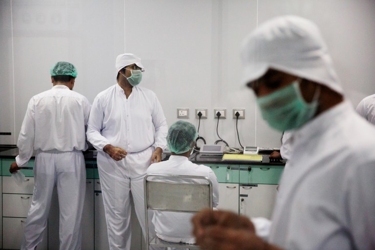 Employees work inside a laboratory at a pharmaceutical plant in India producing generic medicines to treat HIV
