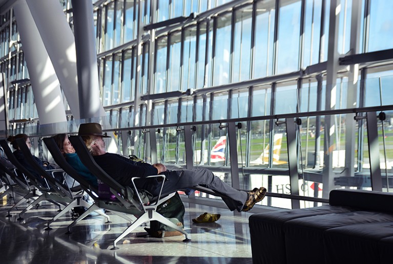 Airplane passengers sleep in a designated 'Quiet Area' at Heathrow International Airport in London, England.