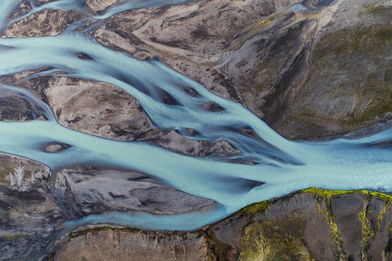 Aerial view of landscape with a river coloured by glacial melt in Kirkjubæjarklaustur, Sudurland, Iceland.