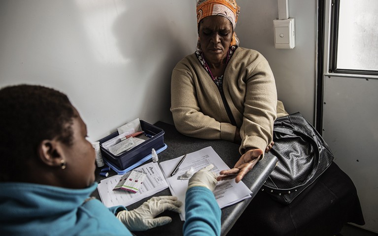 A South African woman gets tested for HIV by an health worker working with Doctors withour borders (MSF) at a mobile clinic.