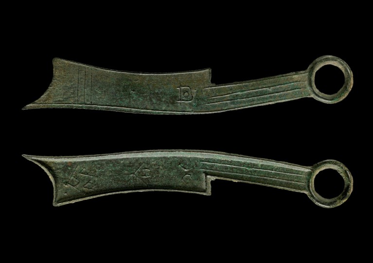 Knife coins used in China around 400 BC on a black background
