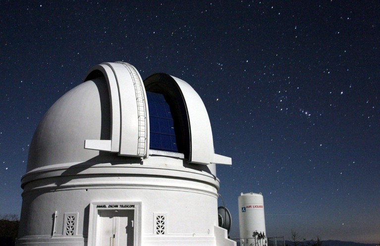 The Samuel Oschin Telescope at the Palomar Observatory is pictured at night