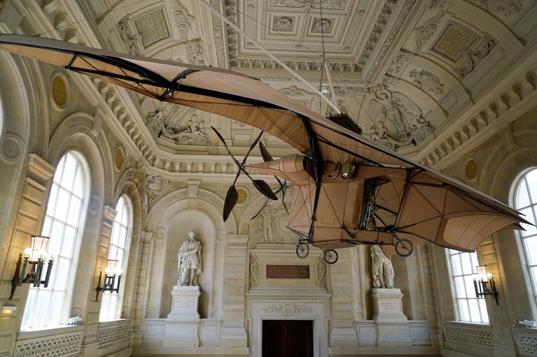 The original Clément Ader's Avion III aircraft on display from the ceiling at the Musée des Arts et Métiers in Paris, France.