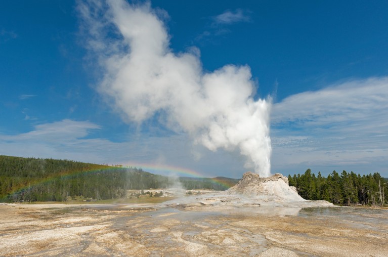 Geyser erupting from a volcano