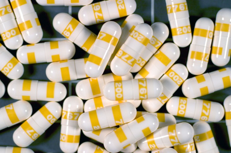 A pile of yellow and white capsules of the prescription medicine Celebrex (celecoxib)