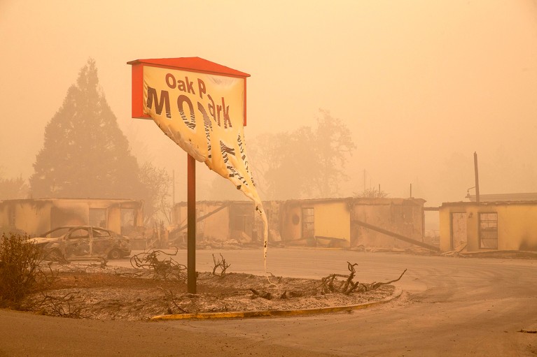 The melted sign of the Oak Park Motel destroyed by the flames of the Beachie Creek Fire is seen in Gates, east of Salem, Oregon.